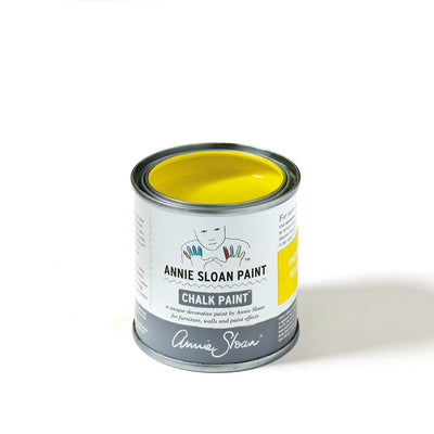 Can of Annie Sloan Chalk Paint in the color of English yellow.
